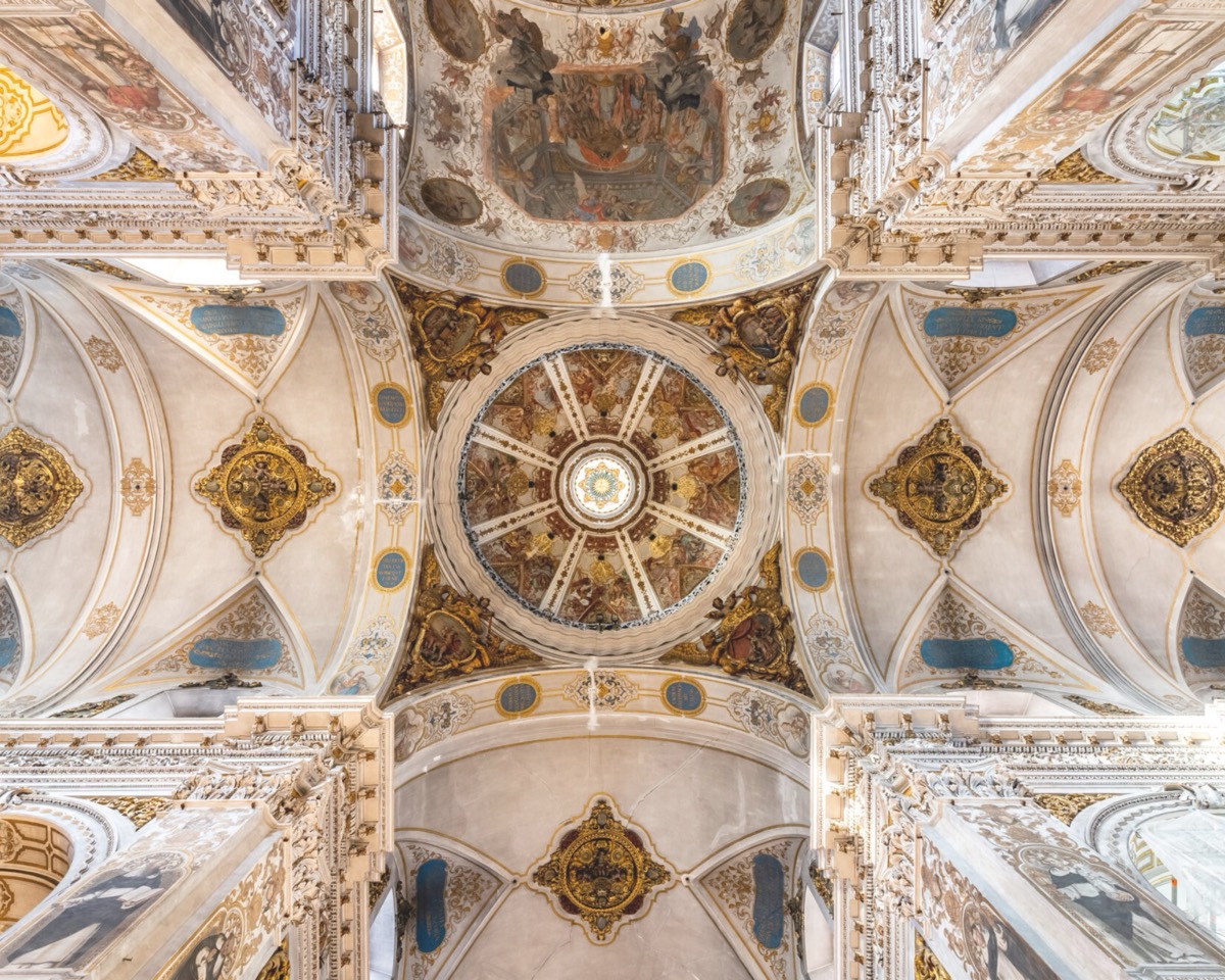 Ornate, gilded baroque ceiling of a Sevillian chapel seen from below